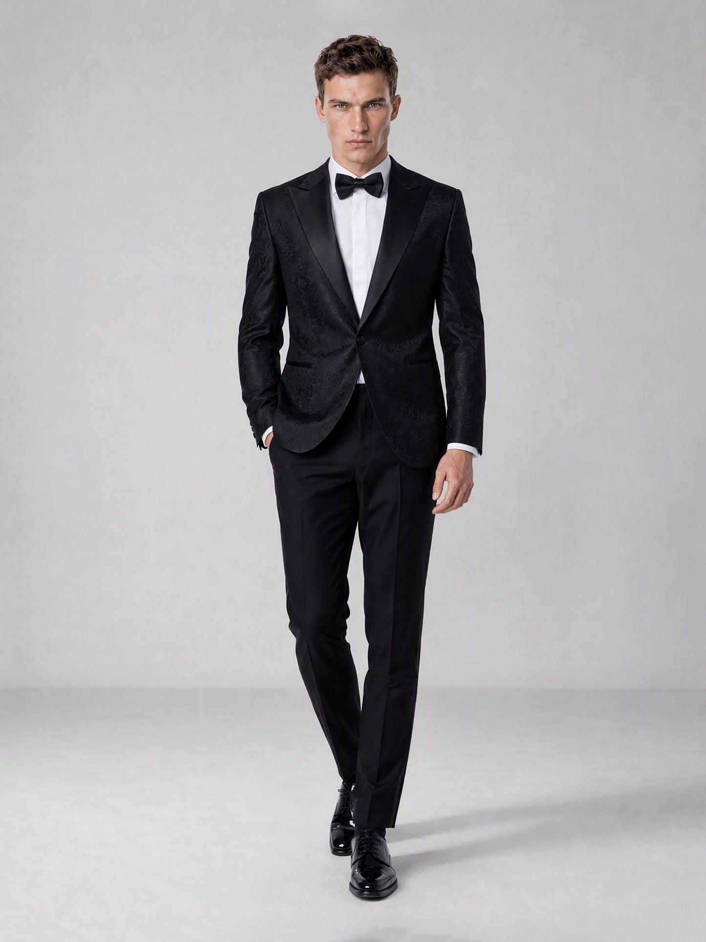 Men's Black Jacquard Peak Lapel Tuxedo Suit – Full Body Front Walking View