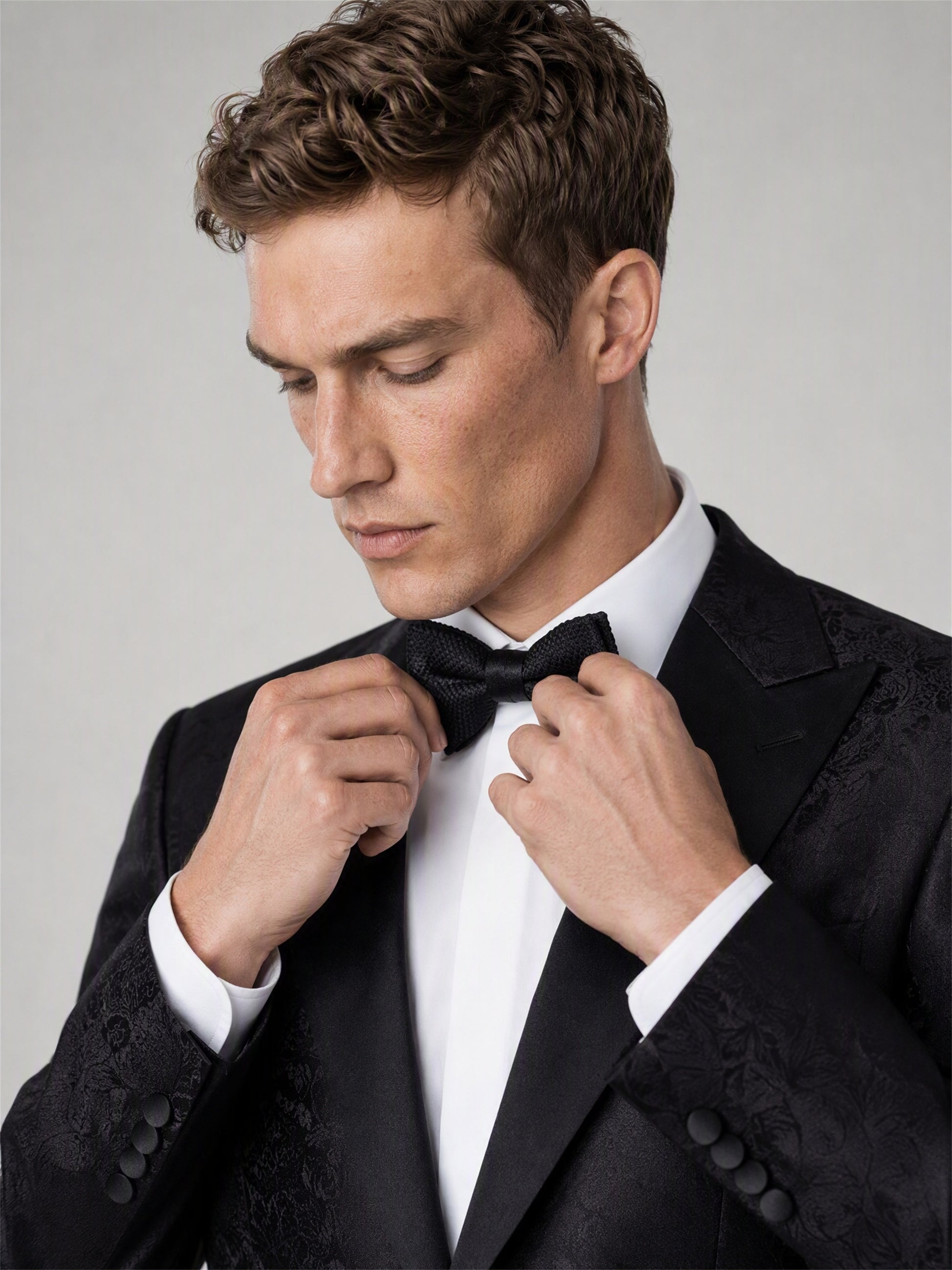 Men's Black Jacquard Peak Lapel Tuxedo Suit – Bow Tie Adjustment Close-Up