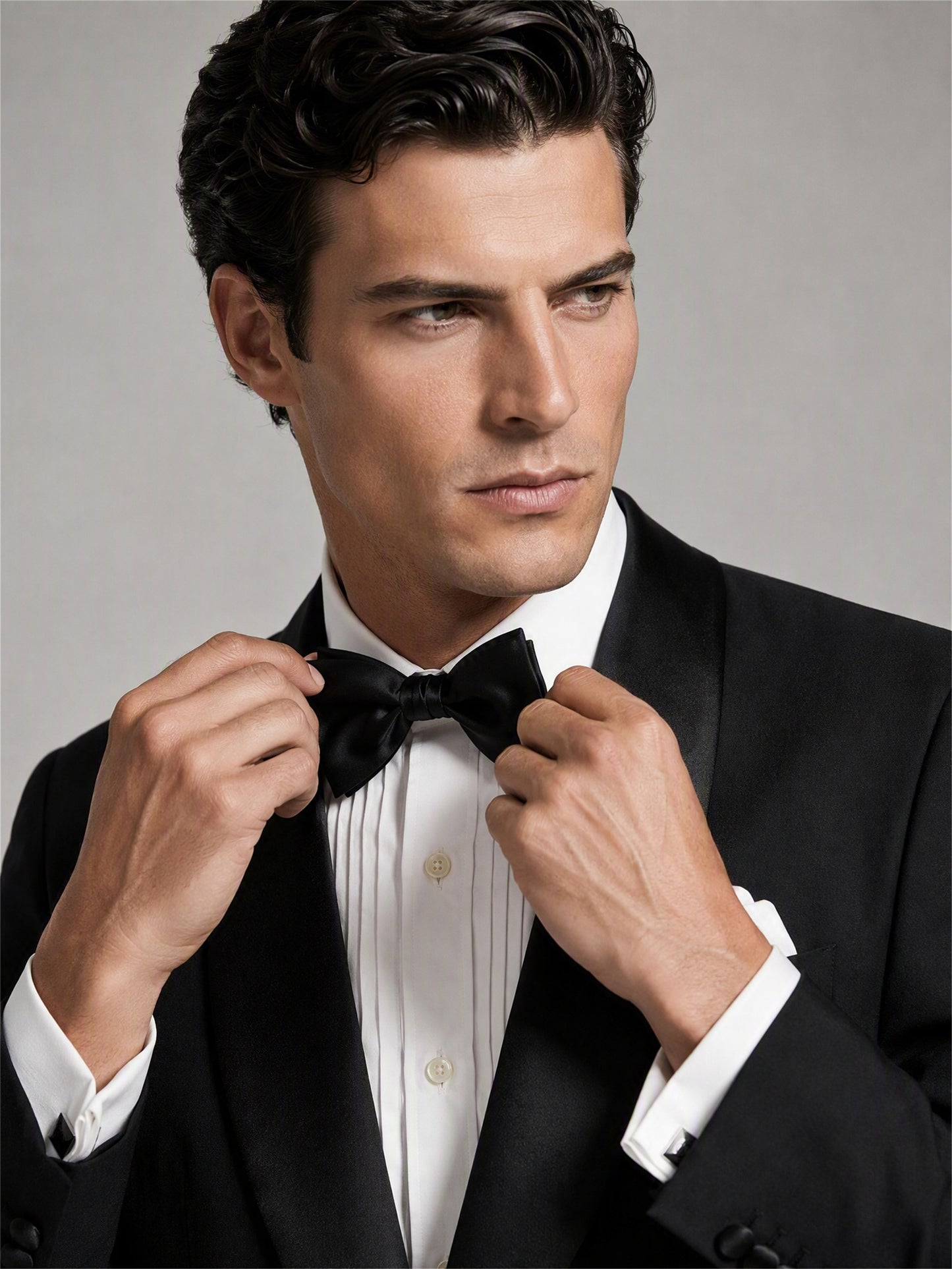 Savile GA0133 black tuxedo suit - upper body close-up showing satin shawl lapel and bow tie detail