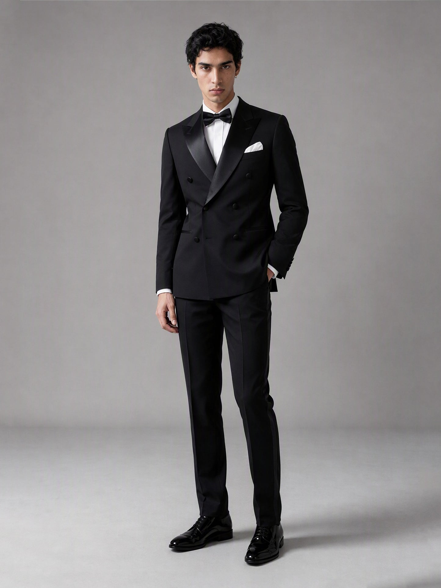 Savile GA0139 black double-breasted tuxedo suit - full front view showing satin peak lapel, white pocket square and bow tie