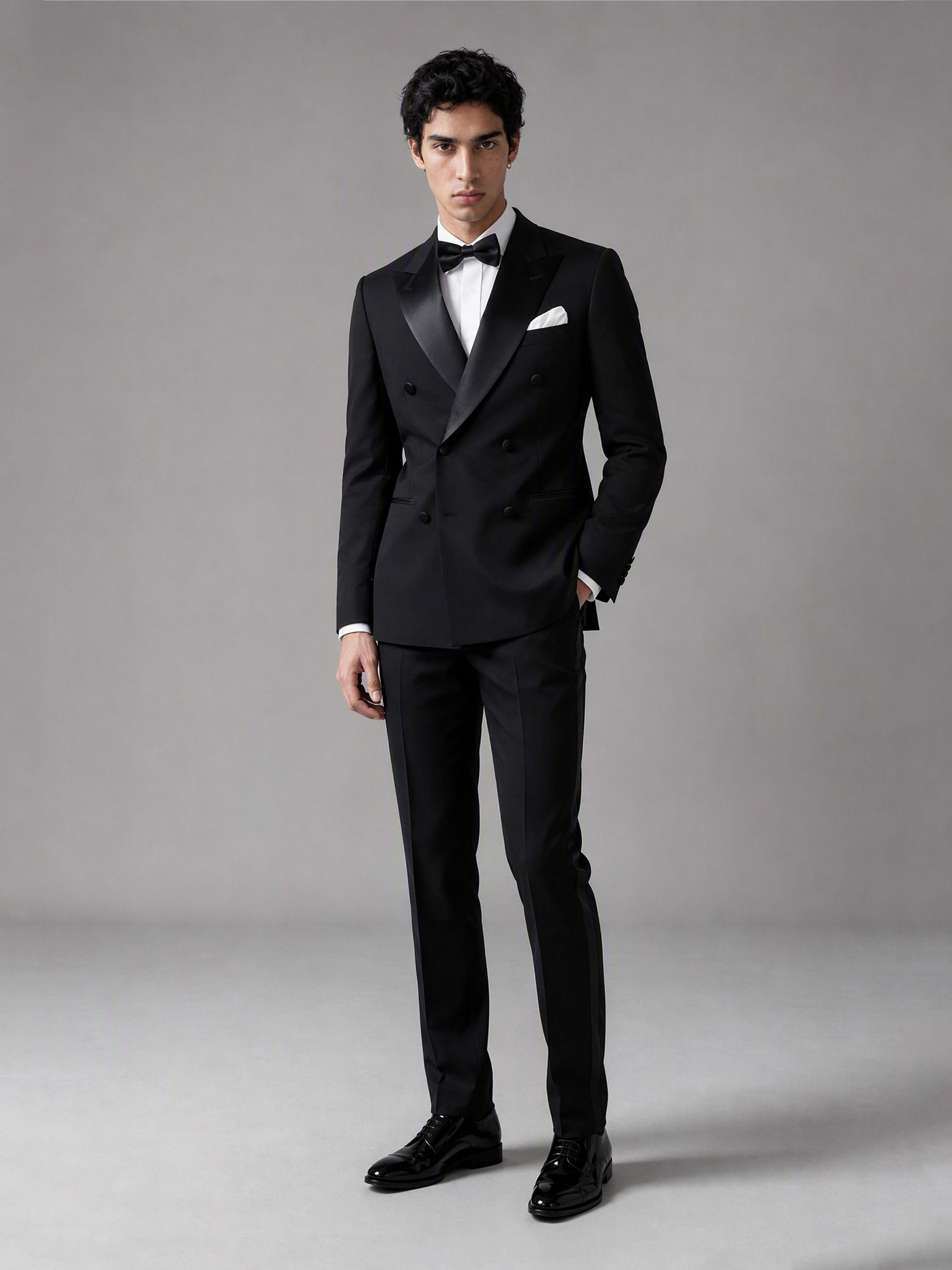 Savile GA0139 black double-breasted tuxedo suit - full front view showing satin peak lapel, white pocket square and bow tie
