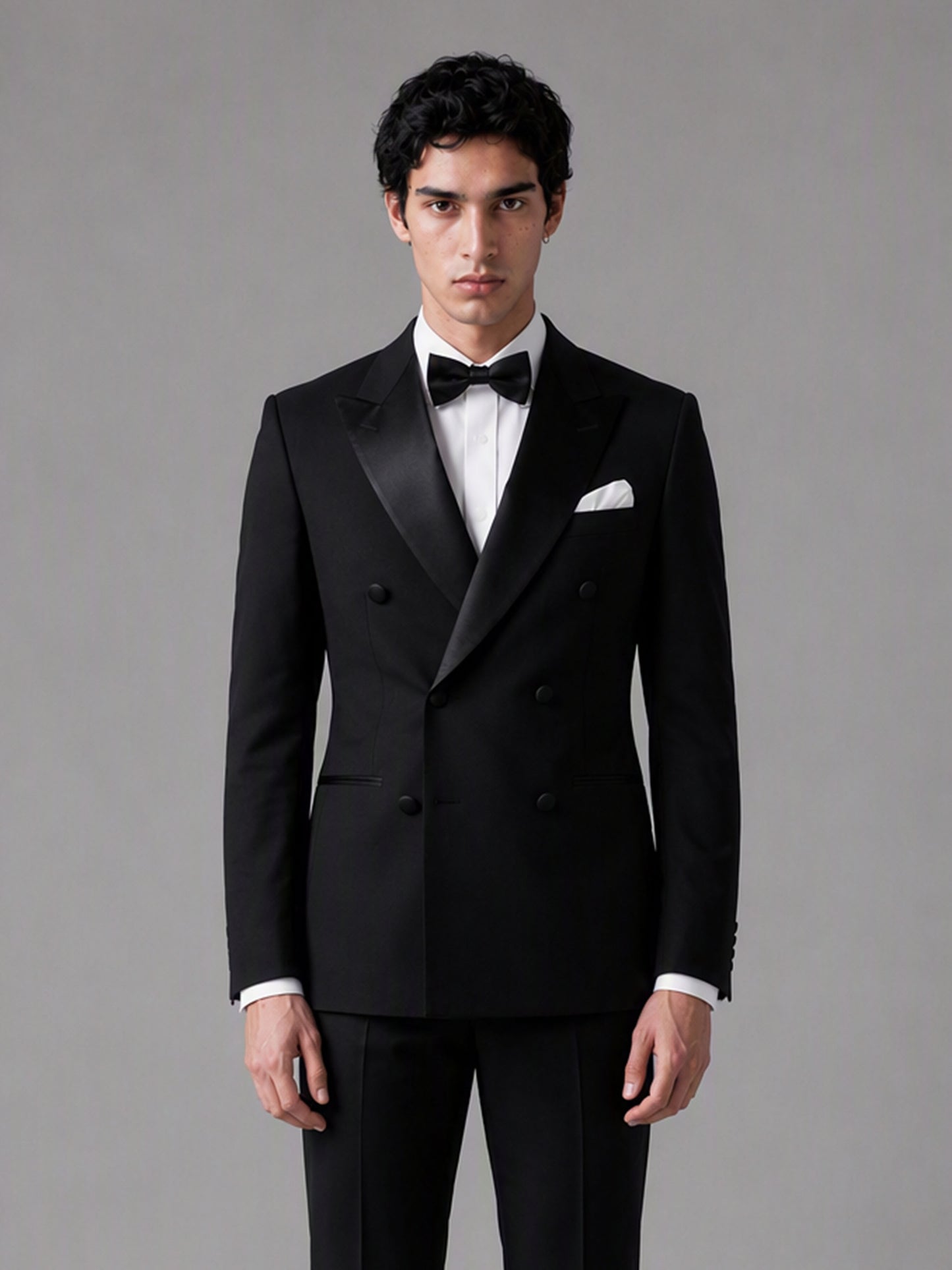 Savile GA0139 black tuxedo suit - upper body close-up showing sharp satin peak lapel and double-breasted button detail
