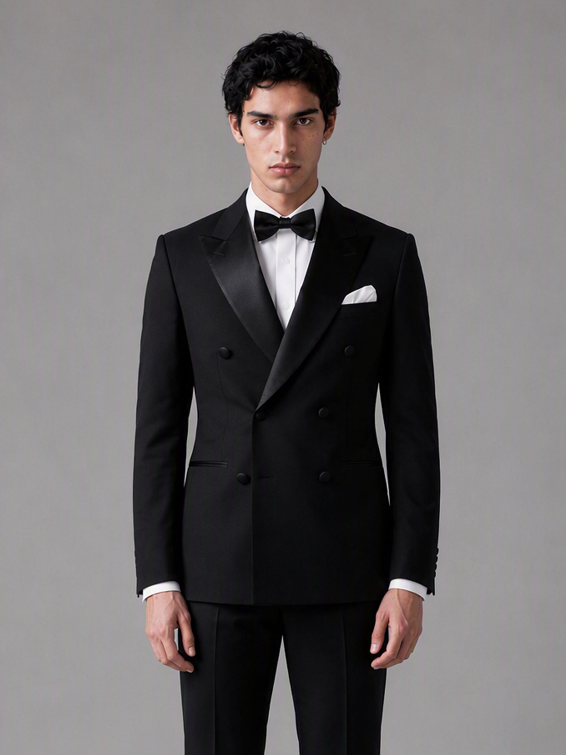 Savile GA0139 black tuxedo suit - upper body close-up showing sharp satin peak lapel and double-breasted button detail