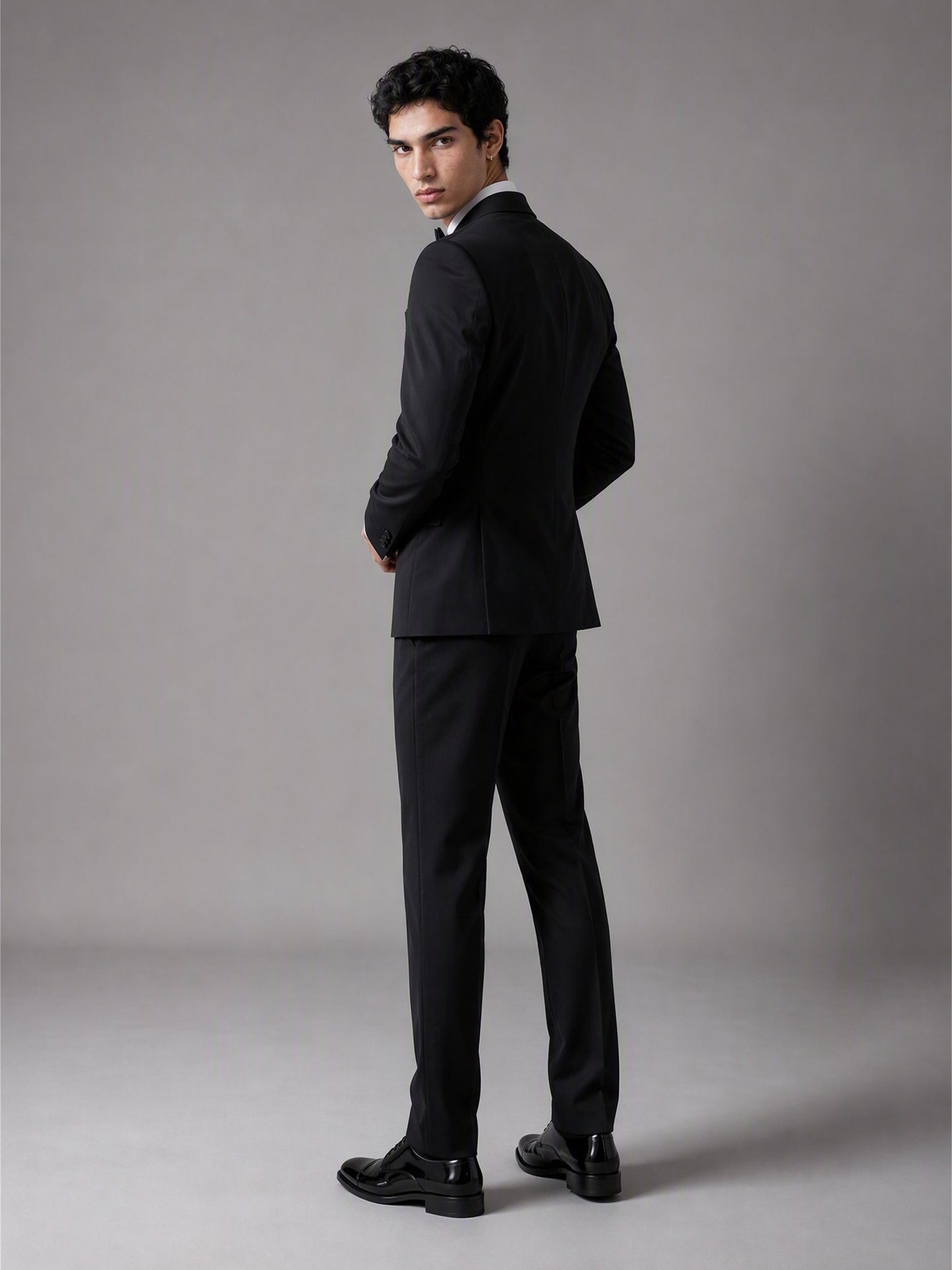 Savile GA0139 black double-breasted tuxedo suit set - rear three-quarter view showing clean back construction and slim trouser cut