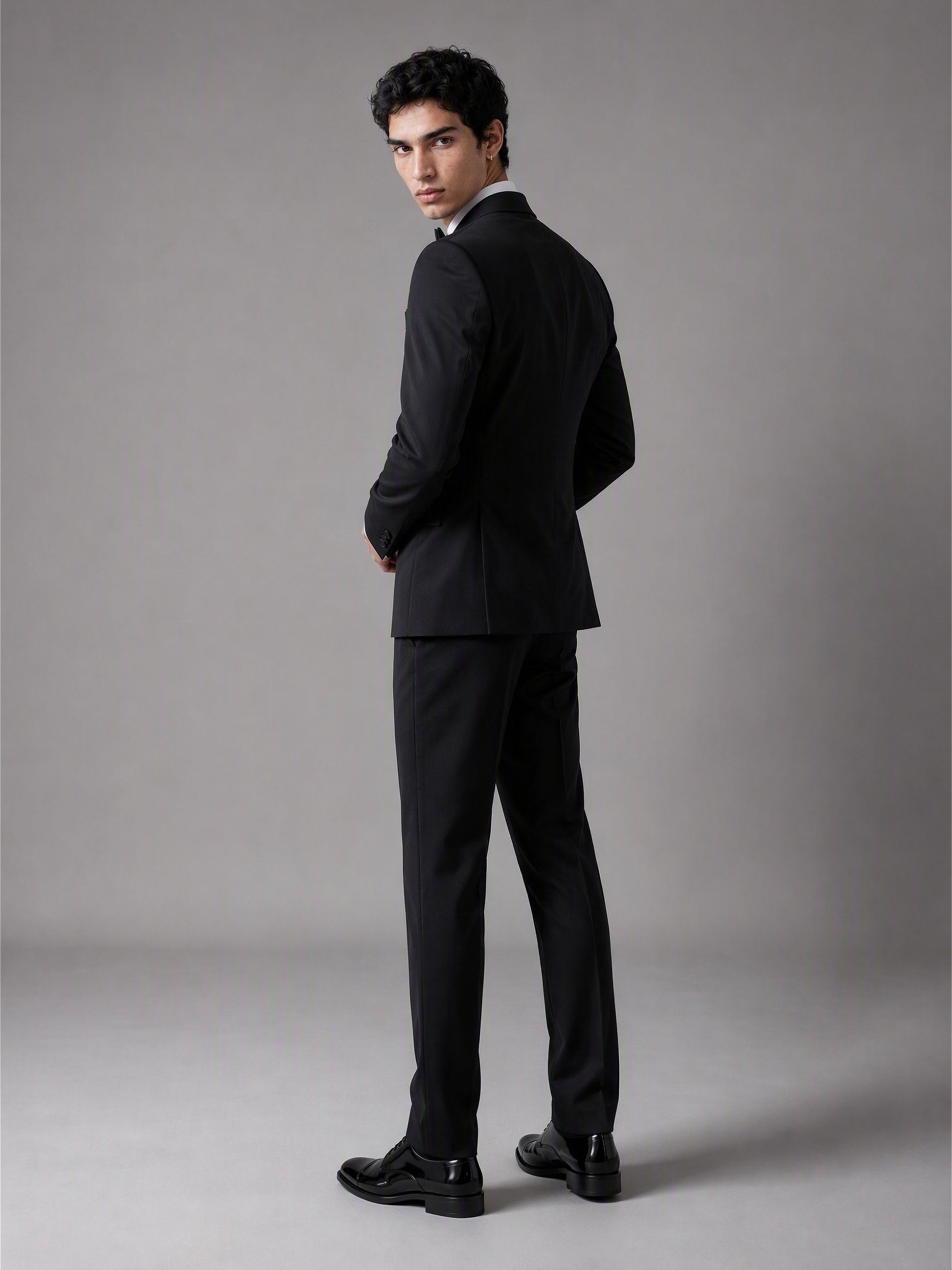 Savile GA0139 black double-breasted tuxedo suit set - rear three-quarter view showing clean back construction and slim trouser cut
