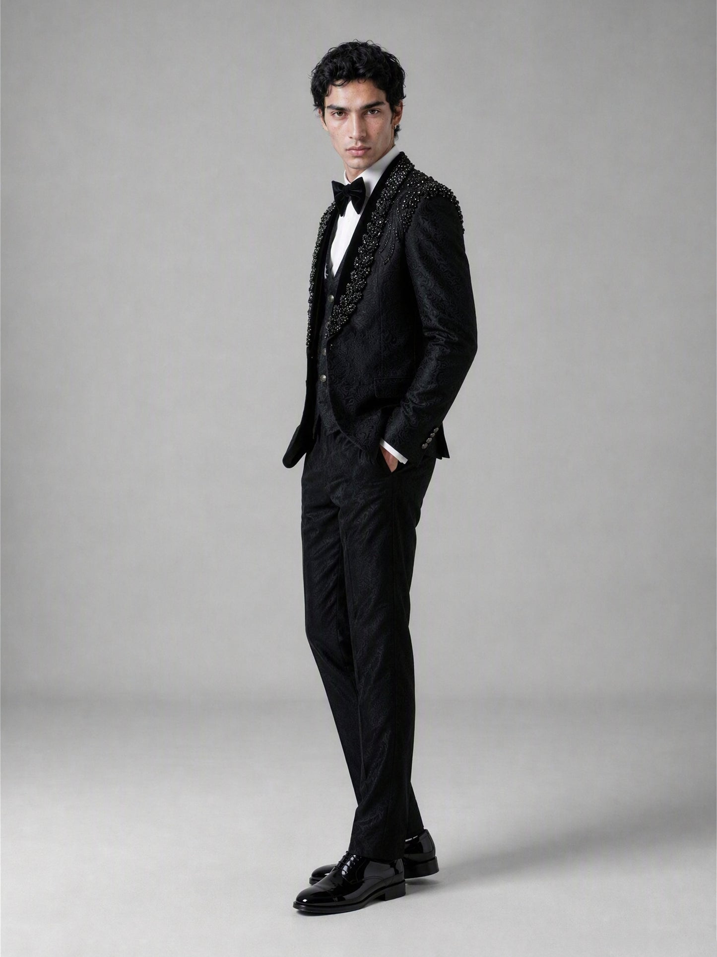 Savile GA0141 black jacquard tuxedo suit - upper body close-up showing crystal and jet bead shoulder embellishment cascading across peak lapel
