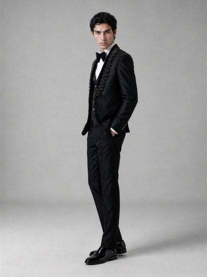 Savile GA0141 black jacquard tuxedo suit - upper body close-up showing crystal and jet bead shoulder embellishment cascading across peak lapel