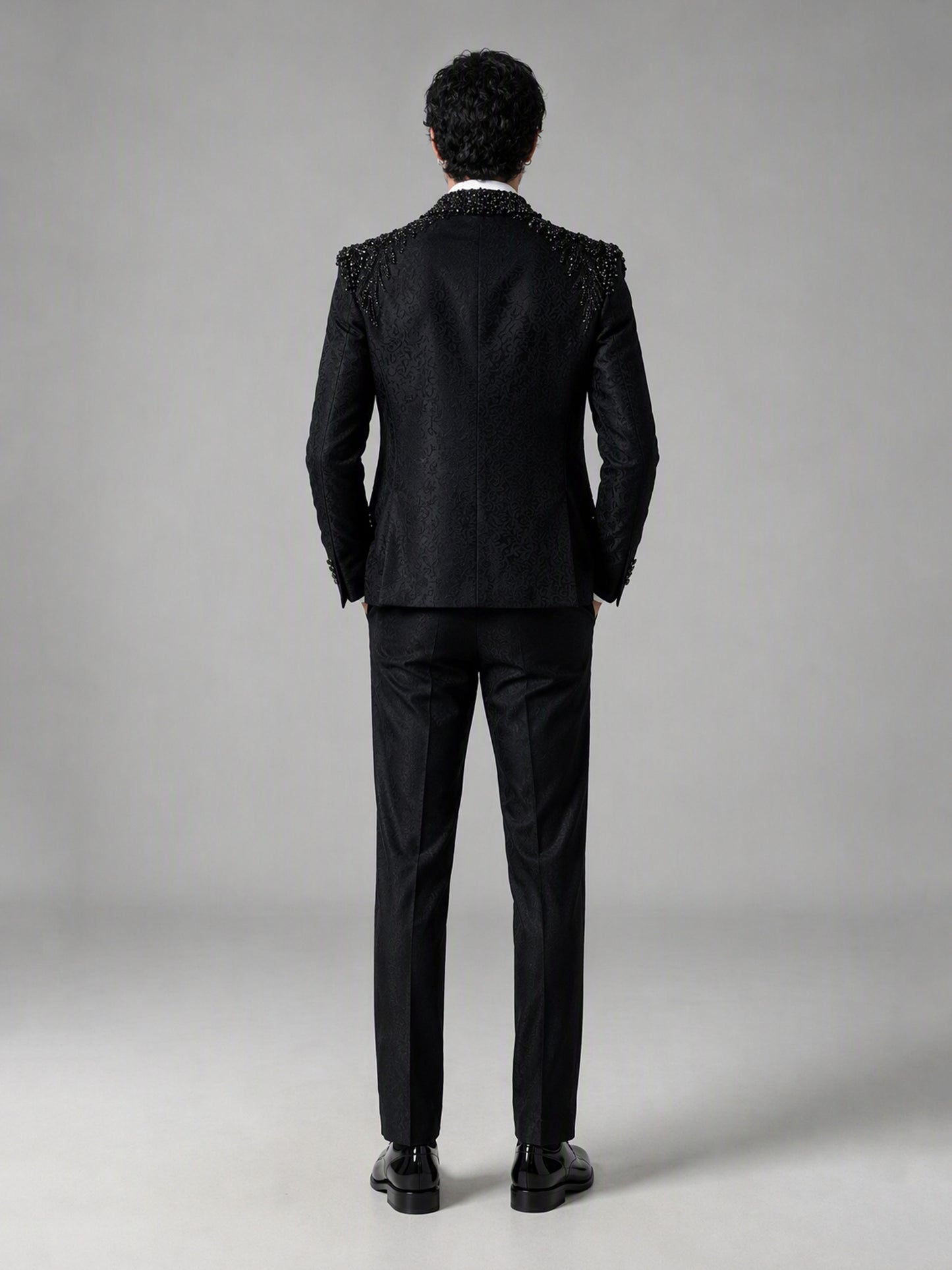 Savile GA0141 black tuxedo suit - three-quarter front view showing crystal shoulder detail, single-breasted vest and slim tailored fit