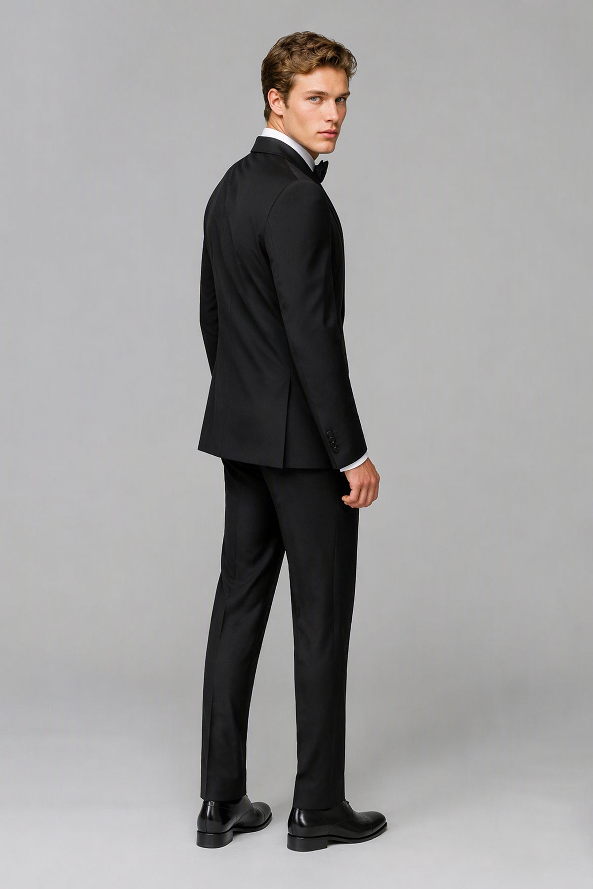 Savile Black 3-Piece Tuxedo Set – Walking front view showing natural drape and slim-fit silhouette