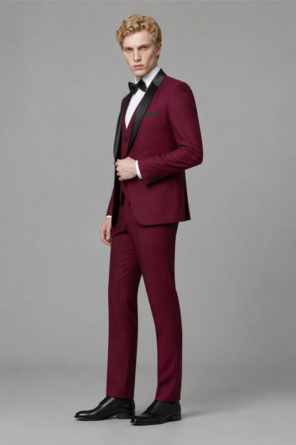 Savile Burgundy 3-Piece Tuxedo Set – Three-quarter front view, model adjusting jacket showing natural drape