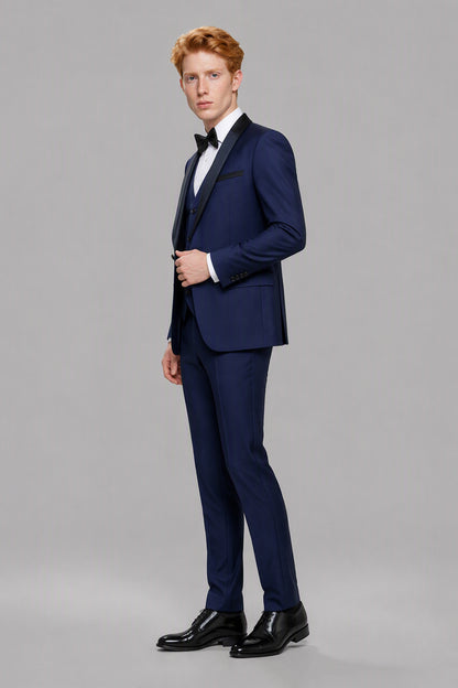 Savile Navy Blue 3-Piece Tuxedo Set – Three-quarter side view, model adjusting jacket showing lapel and fit detail