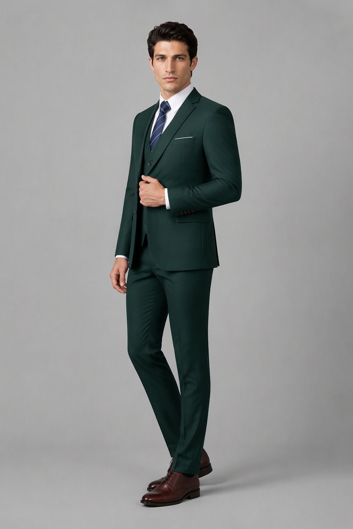Savile Emerald Green 3-Piece Suit Set – Three-quarter front view, model adjusting jacket showing slim-fit silhouette and lapel detail