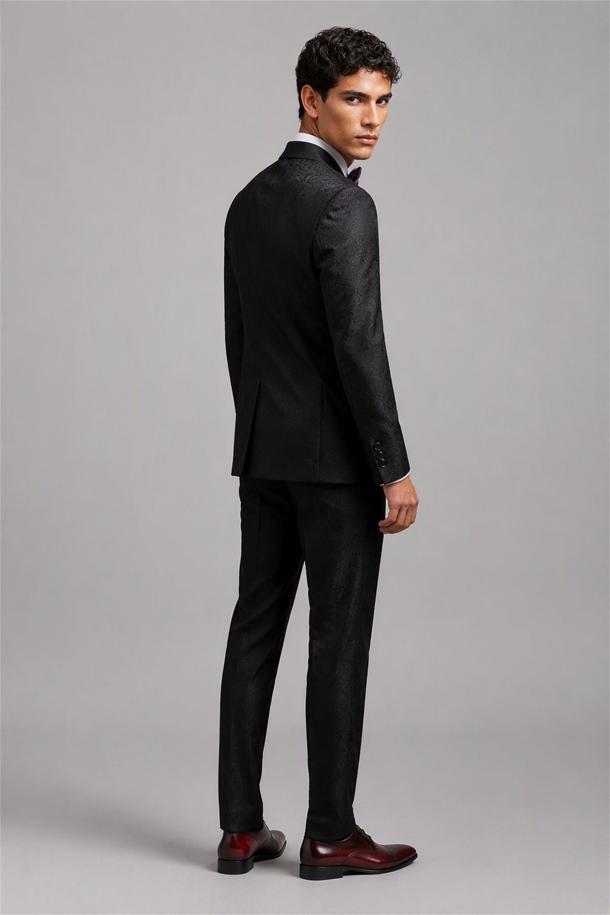 Savile Black Jacquard 3-Piece Tuxedo Set – Full front standing view, hand on jacket showing slim-fit silhouette and satin shawl lapel