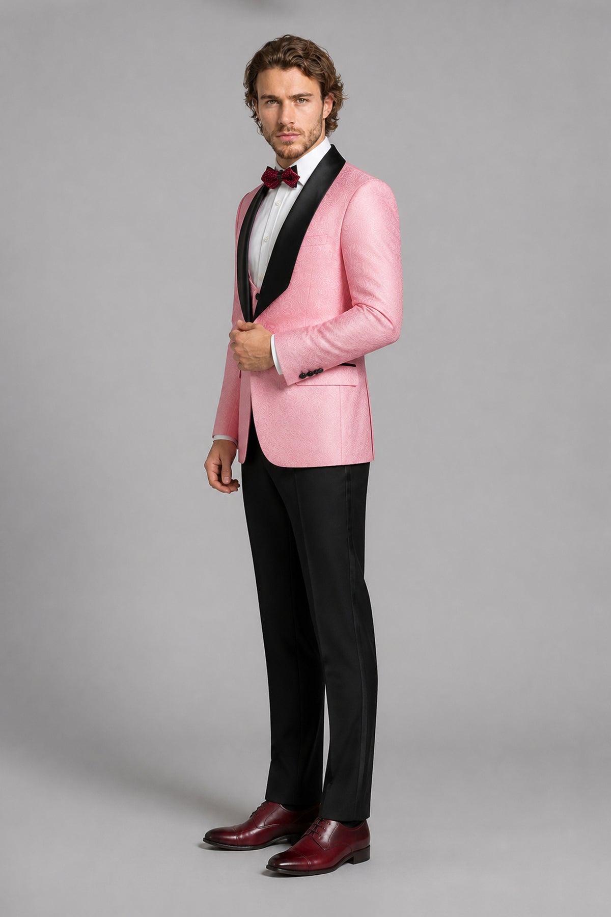Savile Pink Jacquard 3-Piece Tuxedo Set – Three-quarter side view showing pink jacquard texture, satin lapel profile and tapered black trouser fit