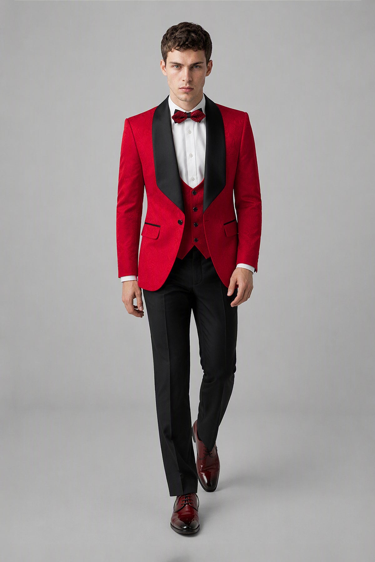 Savile Red 3-Piece Tuxedo Set – Half-body front close-up showing red wool-blend jacket, black satin shawl lapel, red vest with black buttons and red bow tie