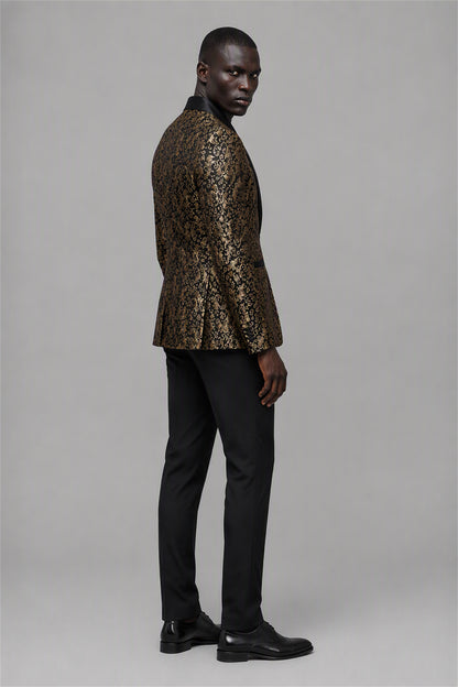 Savile Black & Gold Jacquard Tuxedo Jacket – Three-quarter side view, model holding jacket open showing slim silhouette and black satin peak lapel profile