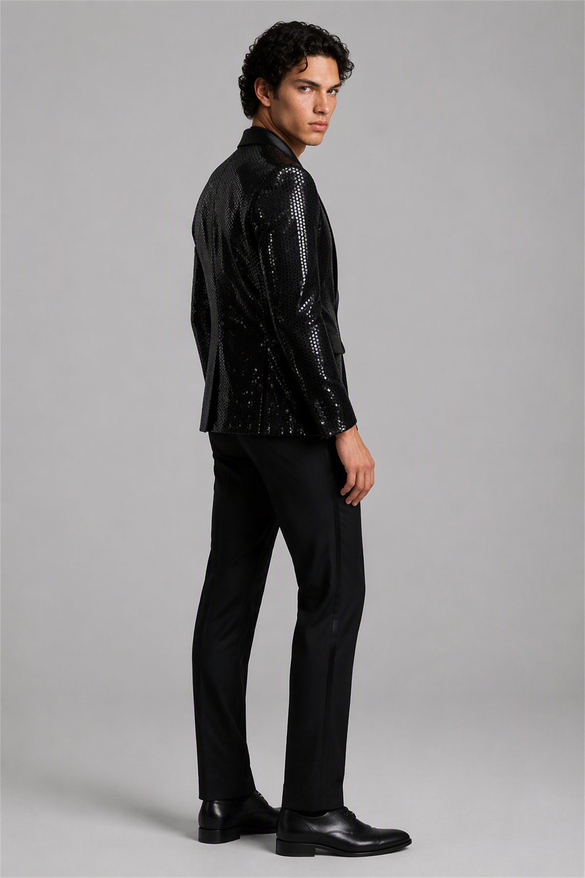Savile Black Sequin Tuxedo Jacket – Full side profile view showing slim silhouette, sequin texture and black satin peak lapel profile