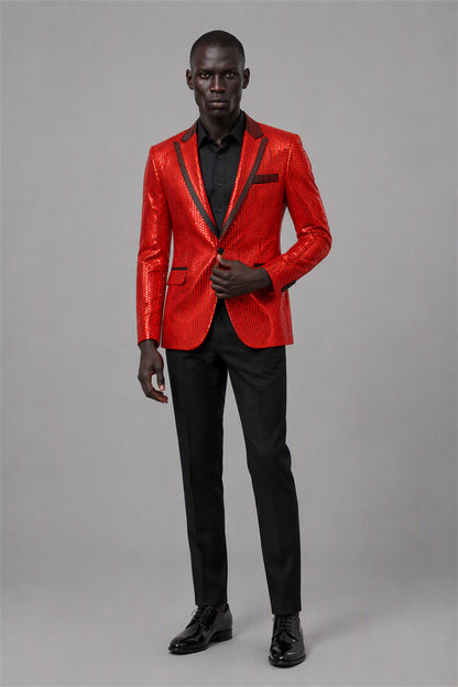 Savile Red Sequin Tuxedo Jacket – Full front walking view showing all-over red sequin jacket with black satin peak lapel, black shirt and black trousers