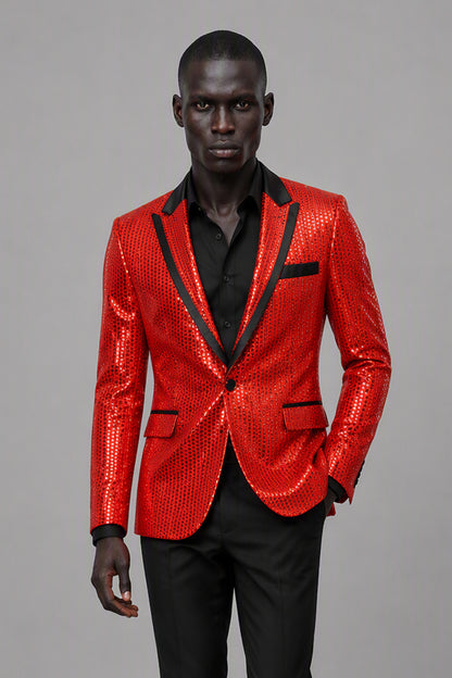 Savile Red Sequin Tuxedo Jacket – Three-quarter front view, hand in pocket showing red sequin texture and black satin peak lapel profile