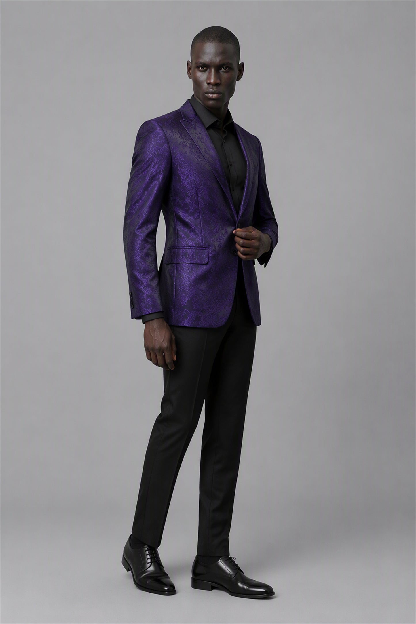 Savile Purple Paisley Jacquard Tuxedo Jacket – Half-body front close-up showing deep purple paisley jacquard weave, black satin peak lapel and pocket trim