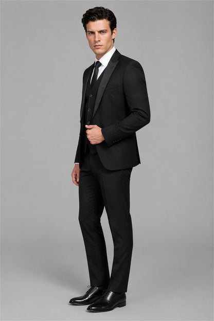 Savile Black 3-Piece Tuxedo Set – Three-quarter side view, hand on jacket showing slim-fit silhouette, shawl lapel profile and white shirt styling
