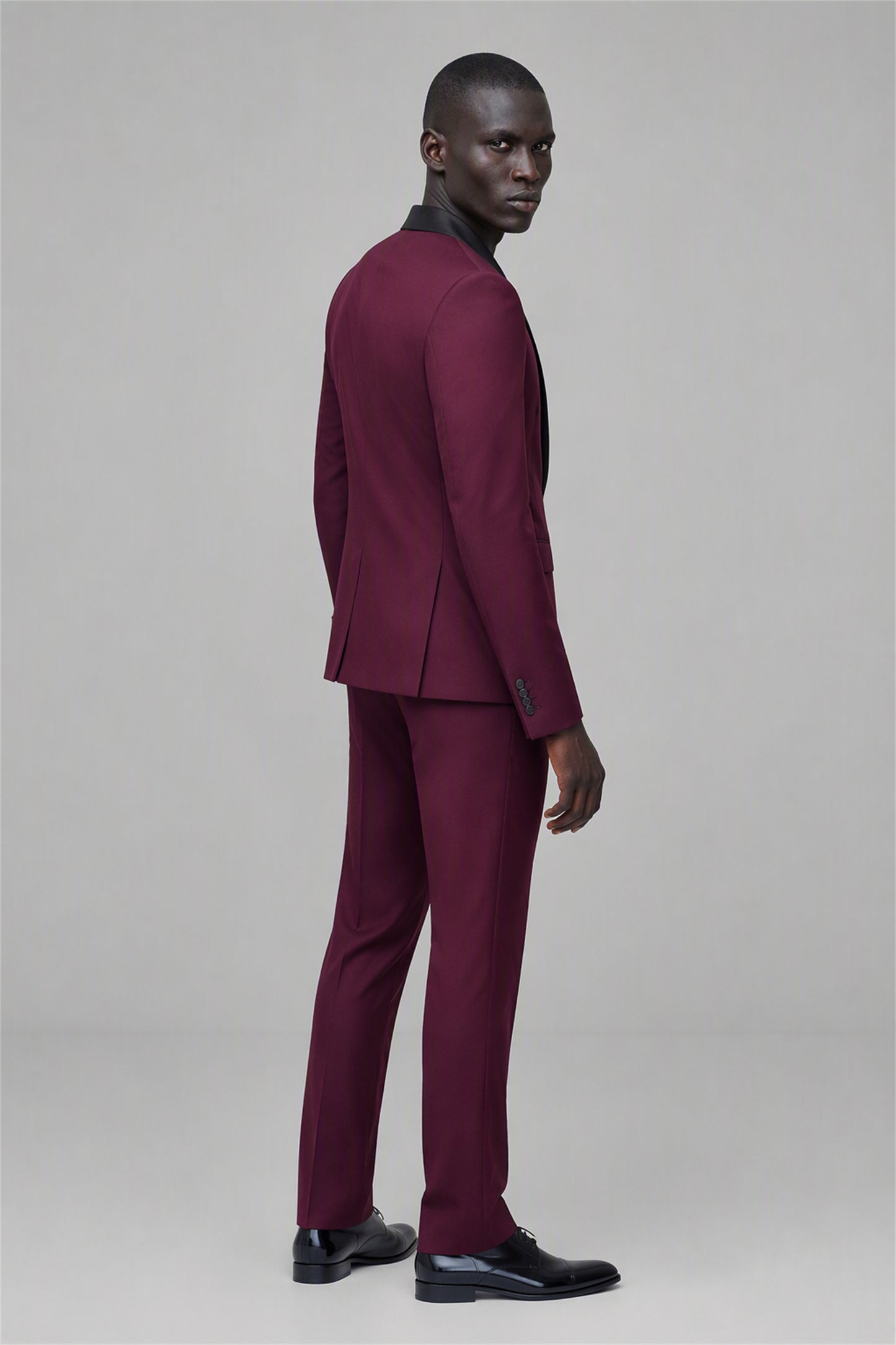 Savile Burgundy 3-Piece Tuxedo Set – Full front standing view, hand in pocket showing complete 3-piece silhouette with jacket, vest and tapered trousers