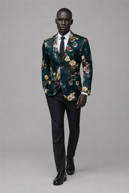 Savile Emerald Green Floral Jacquard Blazer – Full front walking view with white shirt and black tie showing emerald green botanical floral pattern, black notch lapel and black trousers