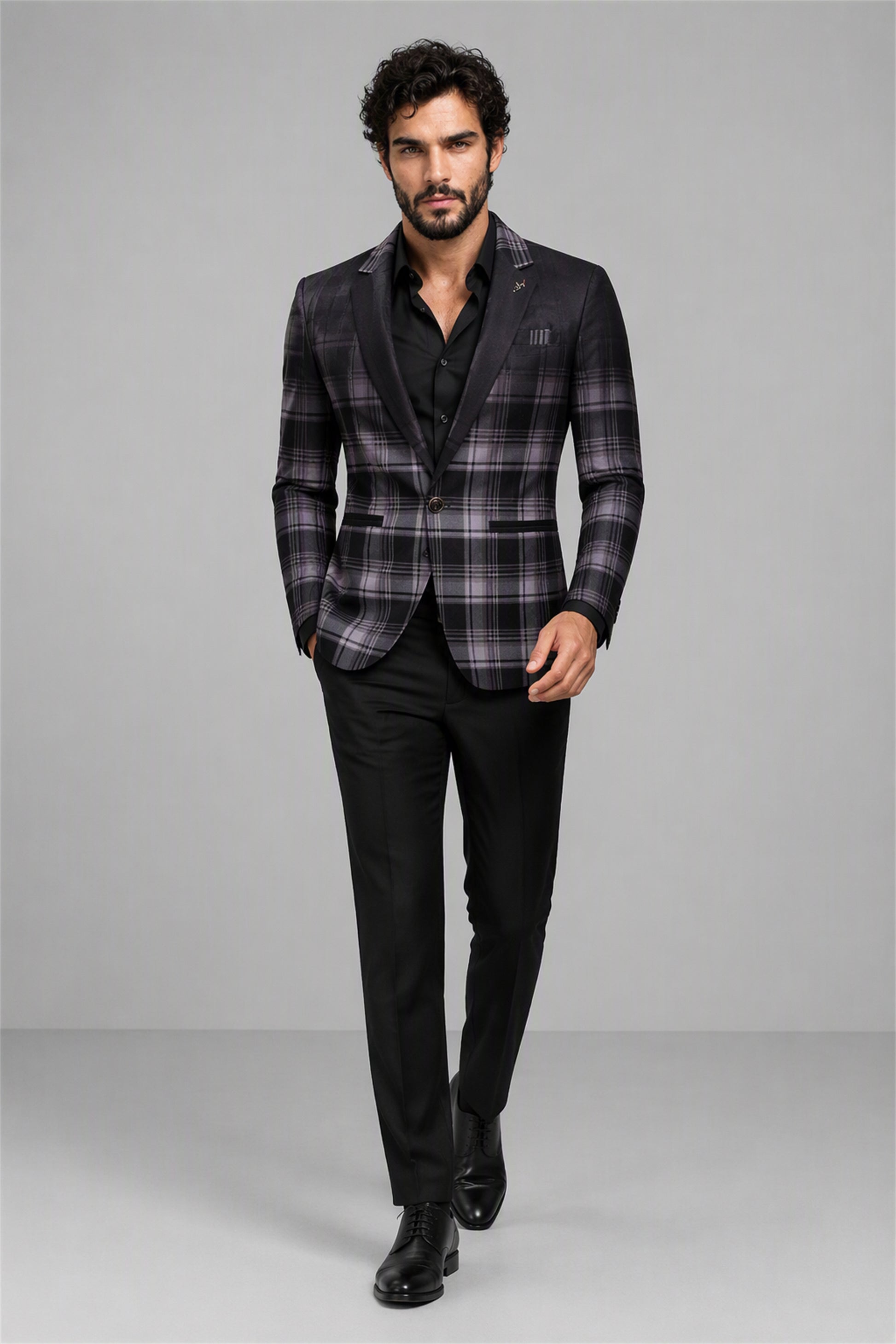 Savile Charcoal Purple Plaid Blazer – Full front walking view with black shirt showing charcoal purple tartan check pattern, black satin notch lapel and black pocket square