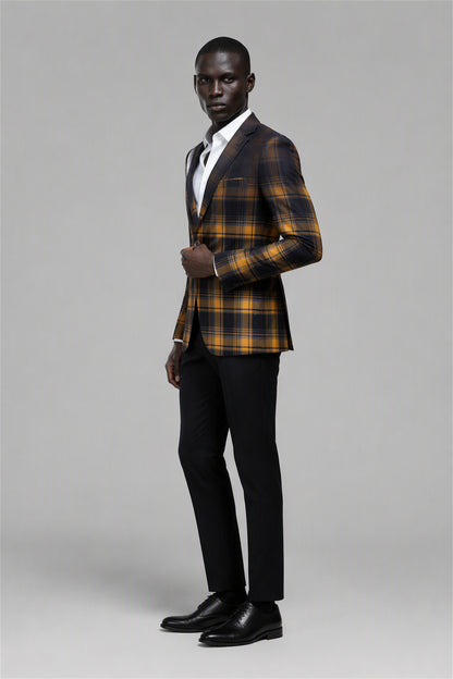 Savile Amber Gold & Navy Tartan Blazer – Three-quarter side view, hand on lapel showing slim silhouette, gold navy tartan texture and black notch lapel profile