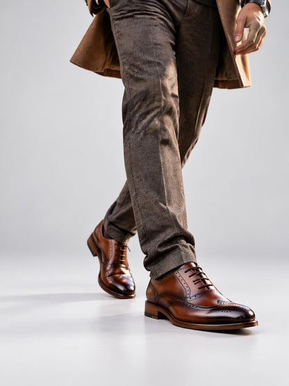 Savile Men's Burnished Brown Wingtip Brogue Oxford Shoes - On-Model Walking Lifestyle with Overcoat