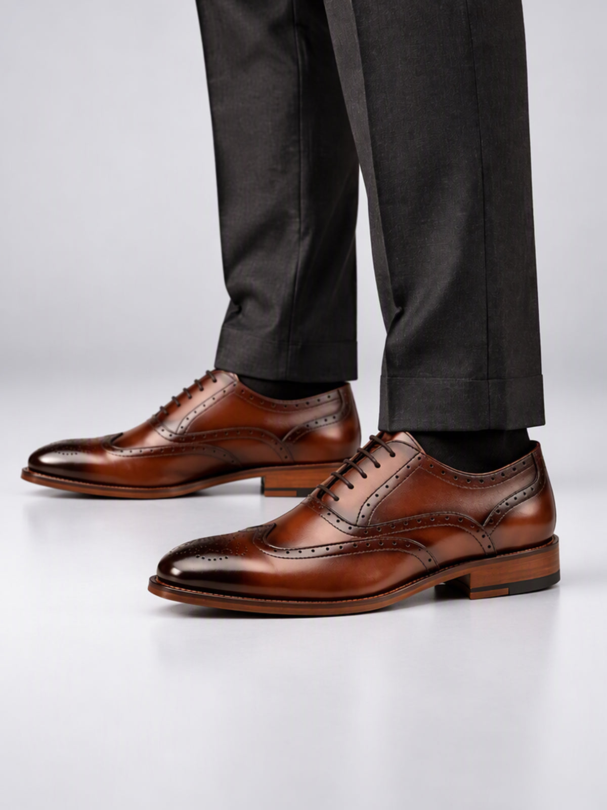 Savile Men's Burnished Brown Wingtip Brogue Oxford Shoes - On-Model Standing Profile with Tailored Trousers