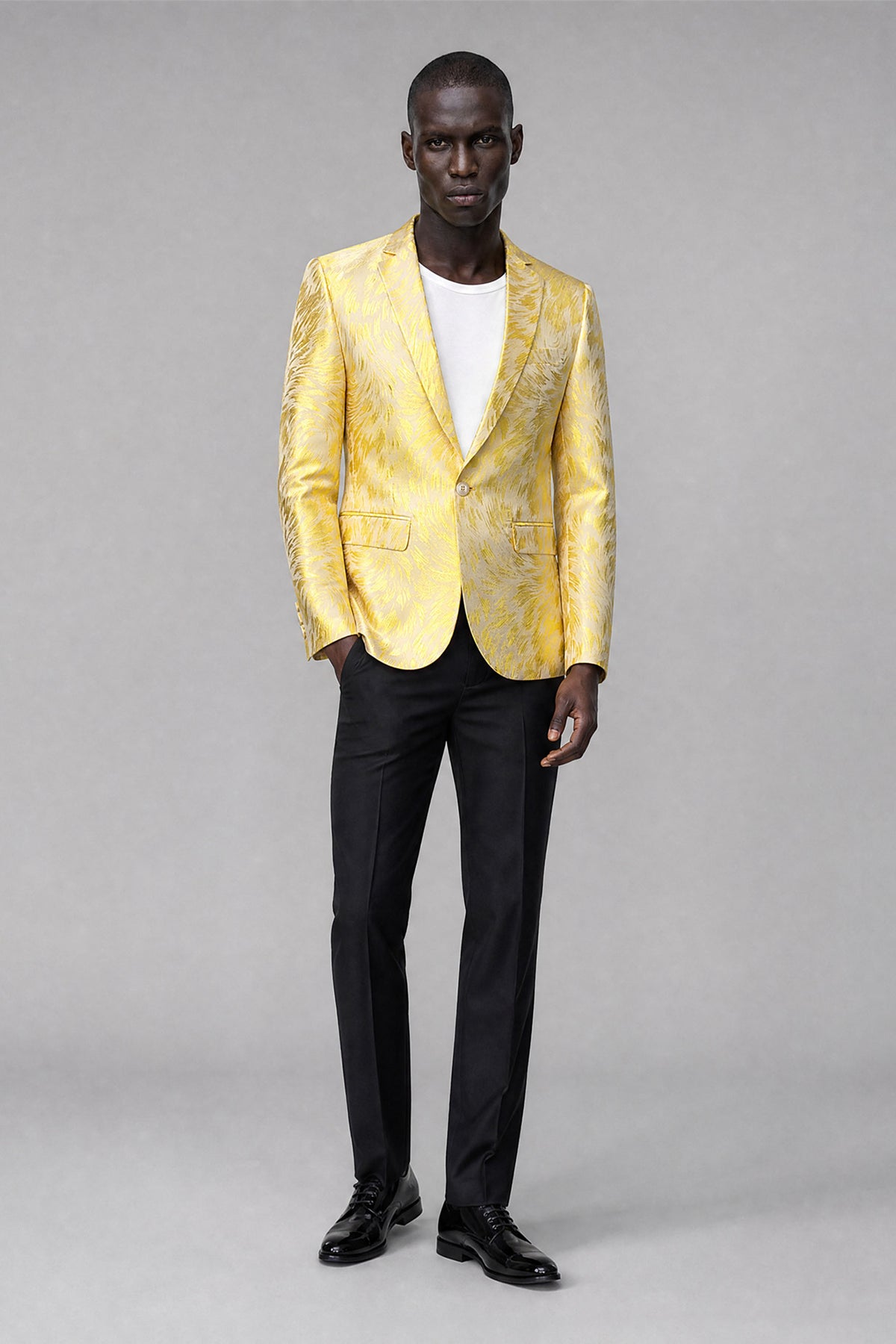 Back view of Savile yellow textured men's blazer; trousers not included